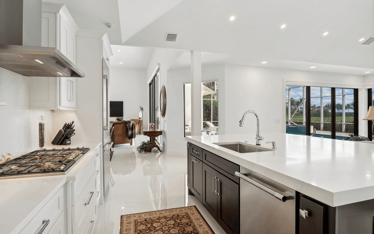 Custom white kitchen with a large island built by PT Signature Cabinetry
