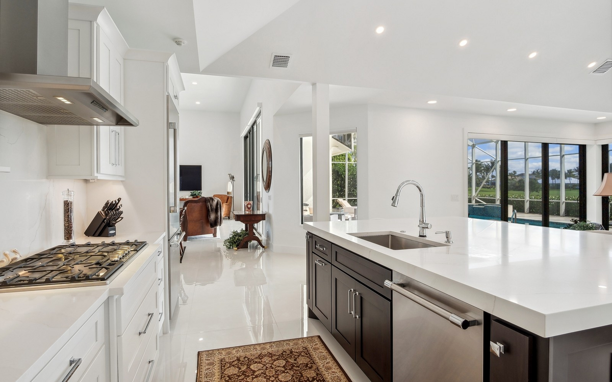 Custom white kitchen with a large island built by PT Signature Cabinetry